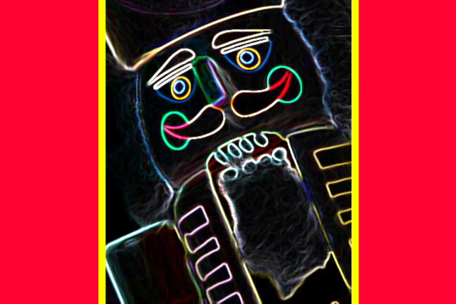 Cartoon drawing of nutcracker face in neon colors against a black background with red and yellow stripes on either side