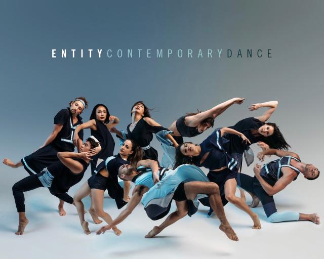 Entity Contemporary Dance Company members posing with logo on top