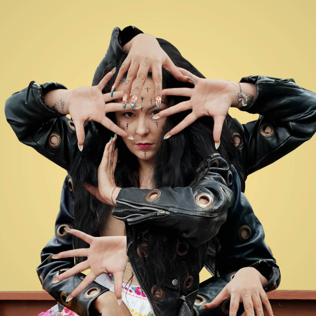 photo of nina looking into the camera with edits of multiple hands placed around her body 
