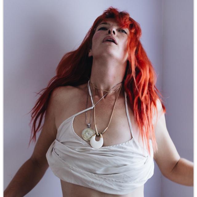 Jasmine Albuquerque looking up with open arms