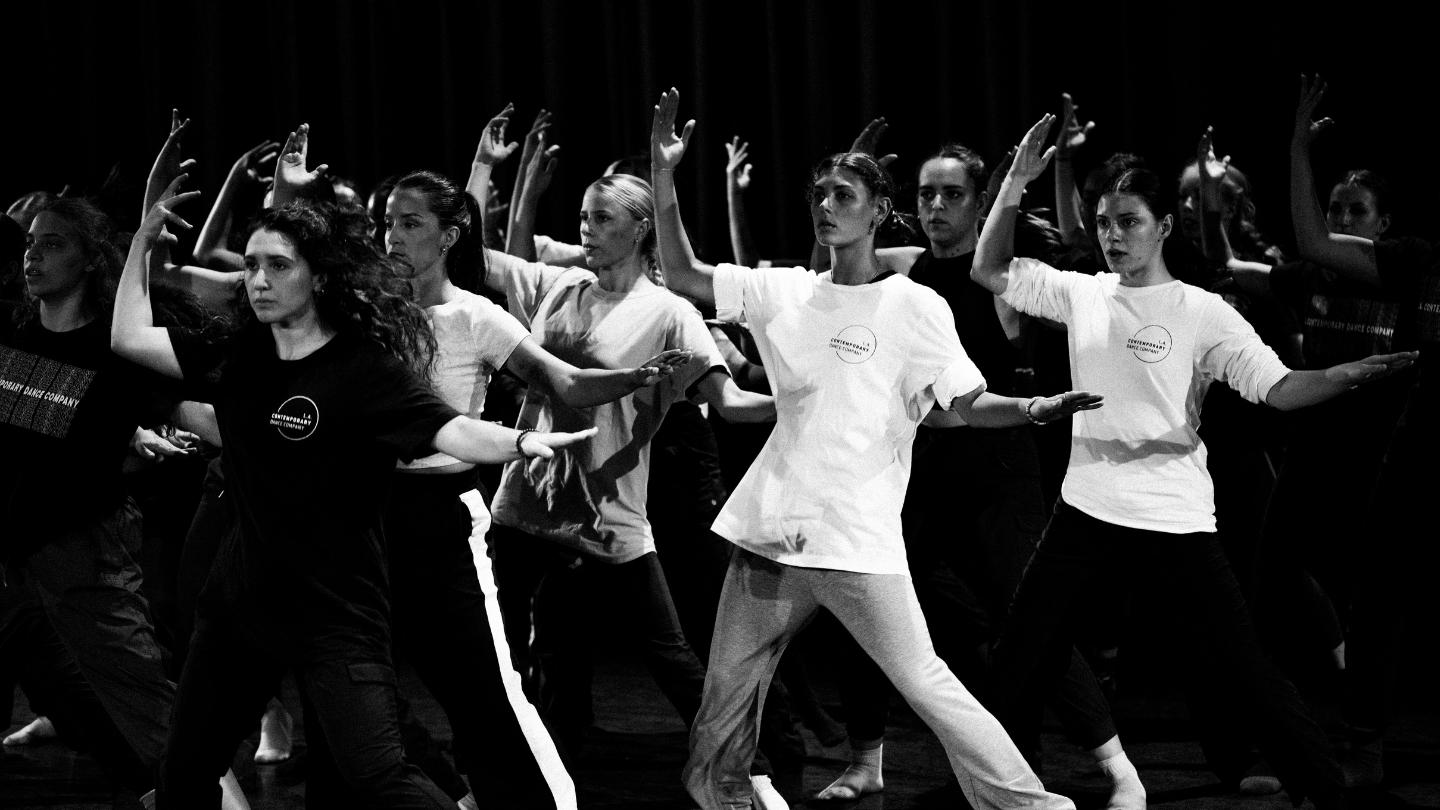black and white image of dancers in the midst of movement